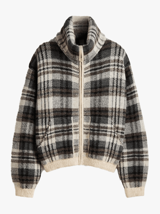 Image may contain Clothing Coat Jacket Knitwear and Sweater