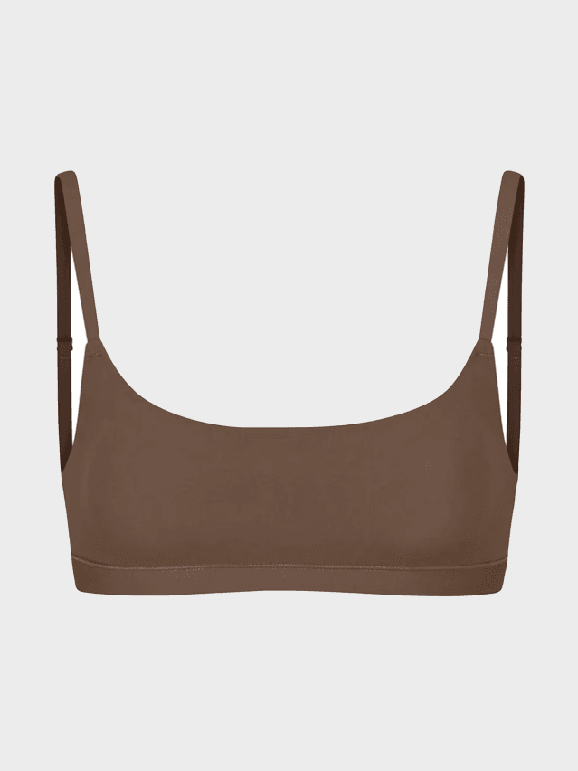 Image may contain: Bra, Clothing, Lingerie, Underwear, Swimwear, Accessories, Bag, Handbag, and Smoke Pipe